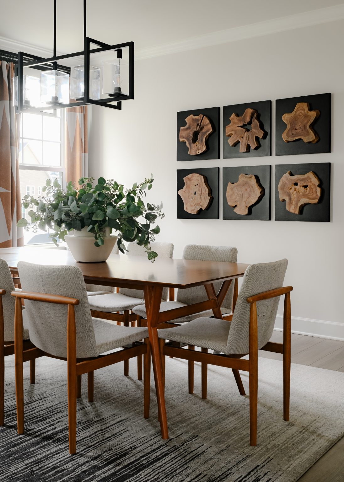 Mid-century dining room with wood slice art